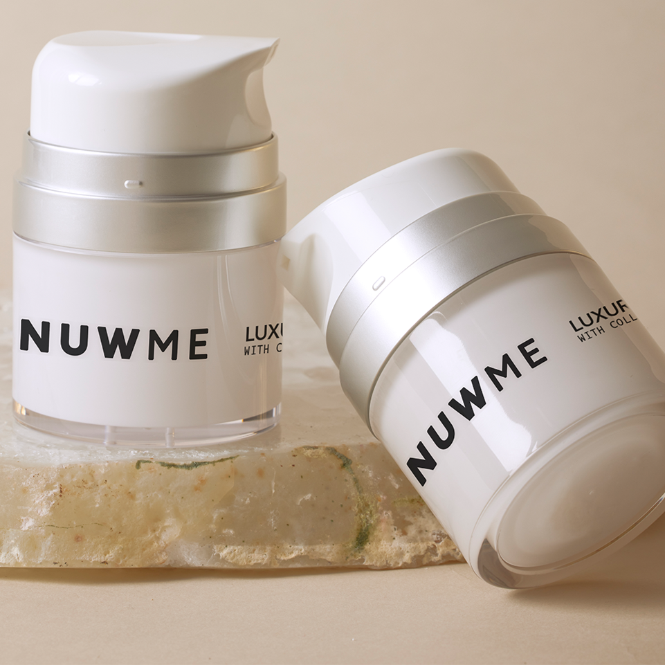 NUWME luxury numbing cream bottles displayed on a vanity, blending elegance with advanced skincare.